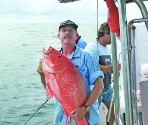 Cameron Carol with a 12kg scarlet sea perch caught on a wonky hole.